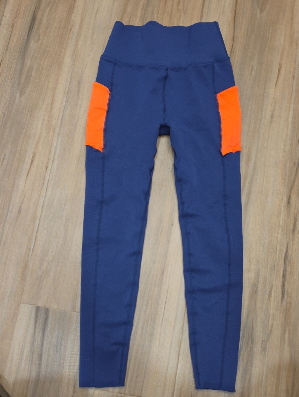 Fabletics Sculpt Knit Navy Leggings with Bright Orange Side Pockets